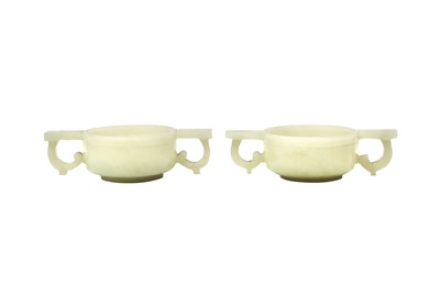 Lot 506 - A PAIR OF CHINESE PALE CELADON HARDSTONE TWIN-HANDLED CUPS