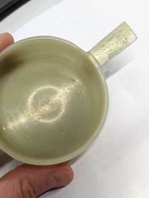Lot 506 - A PAIR OF CHINESE PALE CELADON HARDSTONE TWIN-HANDLED CUPS