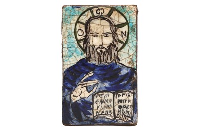 Lot 491 - A DEVOTIONAL POTTERY TILE WITH CHRISTIAN ICONOGRAPHY