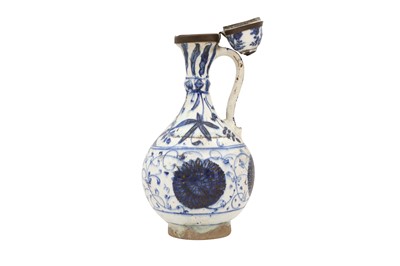 Lot 489 - A GOLD-PAINTED BLUE AND WHITE POTTERY JUG