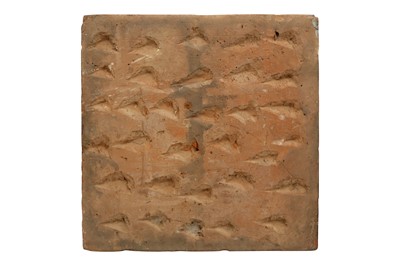 Lot 485 - A MOULDED POTTERY TILE WITH A GEOMETRIC STAR PATTERN