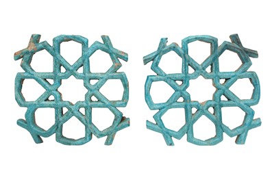 Lot 484 - A PAIR OF GEOMETRIC TURQUOISE-GLAZED EARTHENWARE ARCHITECTURAL ORNAMENTS