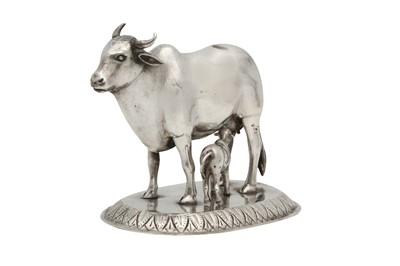 Lot 264 - AN INDIAN SILVER STATUETTE OF A COW AND CALF