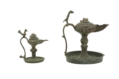 Lot 531 - TWO BRONZE SINGLE-SPOUTED OIL LAMPS