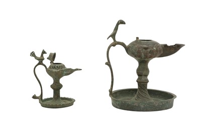 Lot 531 - TWO BRONZE SINGLE-SPOUTED OIL LAMPS
