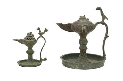 Lot 531 - TWO BRONZE SINGLE-SPOUTED OIL LAMPS