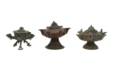 Lot 532 - THREE ENGRAVED AND PIERCED BRONZE OIL LAMPS