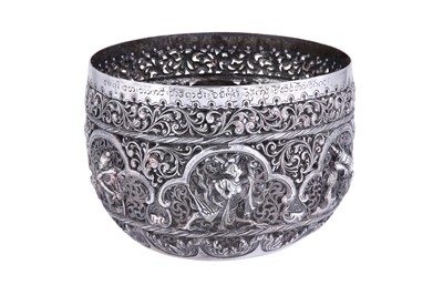 Lot 554 - A BURMESE PIERCED AND REPOUSSÉ SILVER BOWL WITH MYTHICAL CHARACTERS