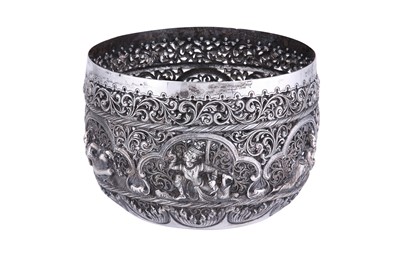 Lot 554 - A BURMESE PIERCED AND REPOUSSÉ SILVER BOWL WITH MYTHICAL CHARACTERS