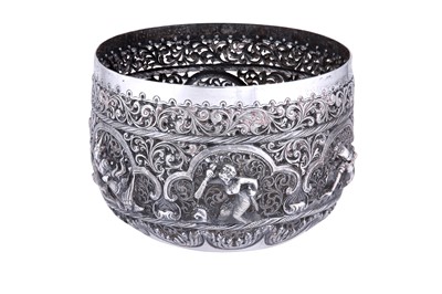 Lot 554 - A BURMESE PIERCED AND REPOUSSÉ SILVER BOWL WITH MYTHICAL CHARACTERS