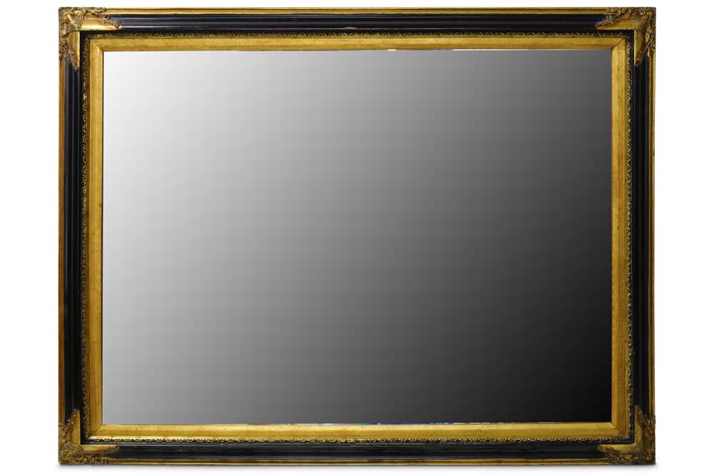 Lot 321 - A LATE TWENTIETH CENTURY EBONISED AND PARCEL GILT RECTANGULAR MIRROR