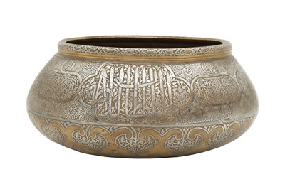 Lot 527 - A FINELY ENGRAVED AND SILVER-INLAID FARS BRASS BOWL