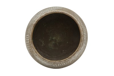 Lot 527 - A FINELY ENGRAVED AND SILVER-INLAID FARS BRASS BOWL