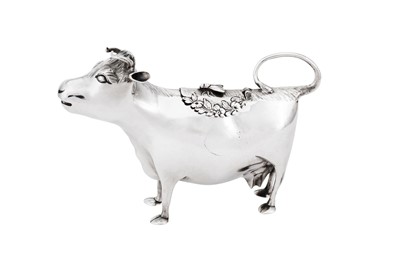 Lot 688 - An early George III sterling silver cow creamer, London 1760 by John Schuppe (reg. 28th June 1753)