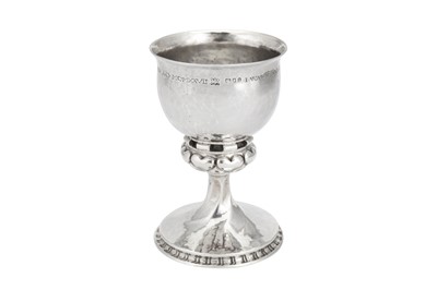 Lot 540 - A George V ‘Arts and Crafts’ sterling silver goblet, London 1925 by Omar Ramsden (1873-1939)