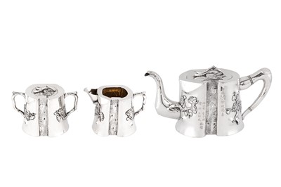 Lot 405 - A good early 20th century Chinese Export silver three-piece tea service, Canton circa 1900 by Yu Dechang