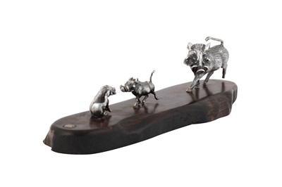 Lot 340 - A contemporary Zimbabwean model of a warthog family, Harare by Patrick Mavros