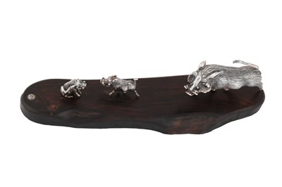 Lot 340 - A contemporary Zimbabwean model of a warthog family, Harare by Patrick Mavros