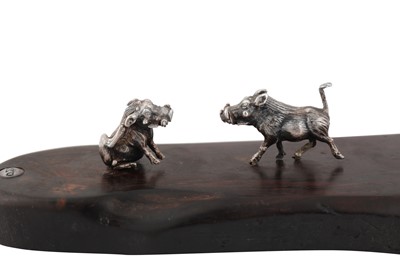 Lot 340 - A contemporary Zimbabwean model of a warthog family, Harare by Patrick Mavros