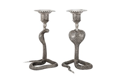 Lot 360 - A pair of mid-20th century Indian unmarked silver candlesticks, circa 1960