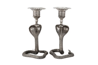 Lot 360 - A pair of mid-20th century Indian unmarked silver candlesticks, circa 1960