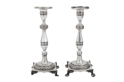 Lot 503 - A pair of early 19th century Portuguese silver candlesticks, Lisbon circa 1815 by Joaquin Prudêncio Vital Dinis (reg. 1812)