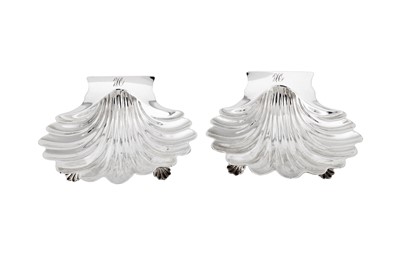 Lot 662 - A pair of George III sterling silver butter shells, London 1764 by John Romer