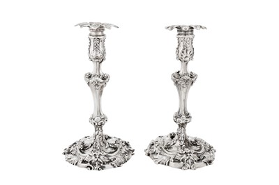 Lot 689 - A pair of George II sterling silver candlesticks, London 1751 by William Gould