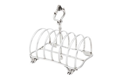 Lot 592 - A Victorian sterling silver seven bar toast rack, London 1858 by John Evans