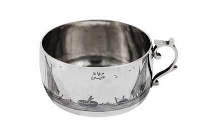 Lot 447 - An early 20th century Iraqi silver and niello tea glass holder, circa 1930 signed Omara, Onaisi (Onaisi Al Fayyadh)