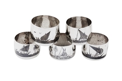 Lot 437 - A mixed group of early 20th century Iraqi silver and niello napkin rings, Omara circa 1920