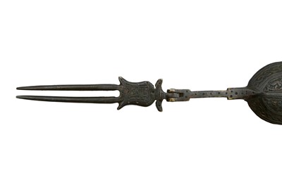 Lot 535 - AN ENGRAVED BRONZE FOLDING SUCKET FORK (OR COMBINED SPOON AND FORK)