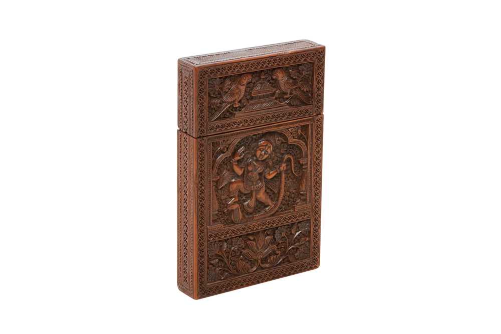 Lot 292 - A CARVED SANDALWOOD CARD CASE WITH HINDU DEITIES