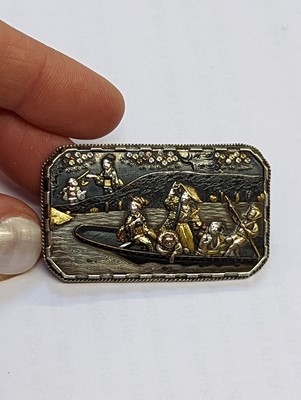 Lot 1040 - A JAPANESE SILVER AND SHAKUDO BROOCH