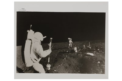 Lot 48 - Apollo 9 - Edgar D. Mitchell, lunar module pilot, operates the Active Seismic Experiment's