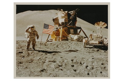 Lot 86 - Apollo 15 Lunar Module Pilot James Irwin salutes the U.S. flag.