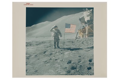 Lot 33 - Apollo 15: Astronaut David Scott gives salute beside U.S. Flag