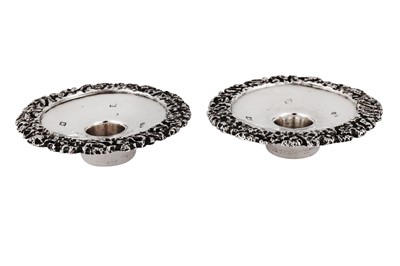 Lot 562 - A pair of Elizabeth II sterling silver cast low candlestick holders, Birmingham 1973 by Deakin and Francis