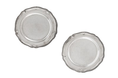 Lot 660 - A matched pair of George III sterling silver dinner plates, London 1785 by James Young and London 1806 by Robert Garrard I