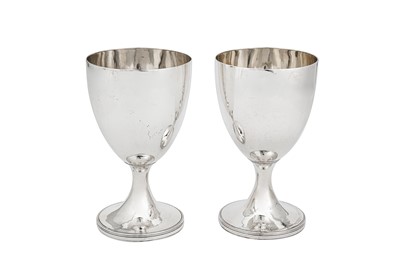 Lot 668 - A pair of George III sterling silver wine goblets, London 1789 by Henry Chawner (reg. 11th Nov 1786)