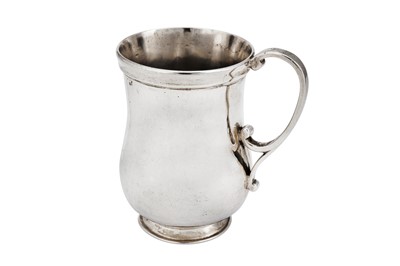 Lot 533 - A George V “Arts and Crafts” sterling silver christening mug, London 1930 by George Hart for the Guild of Handicraft