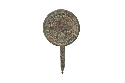 Lot 539 - A SELJUK CAST BRONZE MIRROR WITH SPHINXES