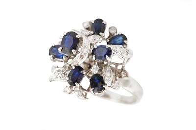 Lot 57 - A sapphire and diamond dress ring