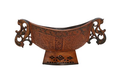 Lot 284 - A POLYCHROME-PAINTED CARVED AND ENGRAVED FRUITWOOD BEGGING BOWL (KASHKUL)