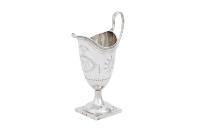 Lot 615 - A George III provincial sterling silver milk jug, Exeter circa 1797 by Richard Jenkins (died 1806)