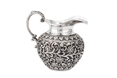 Lot 99 - A late 19th century Anglo – Indian silver cream jug, Cutch, Bhuj by Oomersi Mawji Jnr, import marks for London 1894 by Frank Ledger