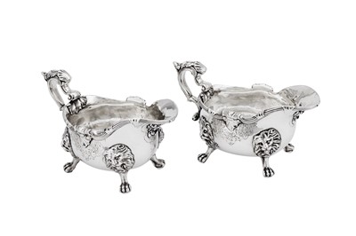 Lot 691 - A rare pair of George II sterling silver sauceboats, London 1740 by Paul de Lamerie (Hertogenbosch 1688 - London 1751, this mark registered 27th June 1739)