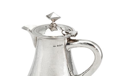 Lot 332 - A George V ‘Arts and Crafts’ sterling silver wine flagon or ewer, Birmingham 1922 by William Bernard Wood