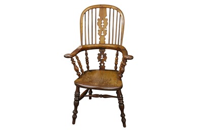 Lot 218 - A LATE 19TH CENTURY YEW AND ELM WINDSOR ARMCHAIR