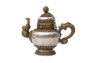 Lot 564 - A FINE TIBETAN WHITE-METAL AND GILT MILK TEAPOT AND COVER